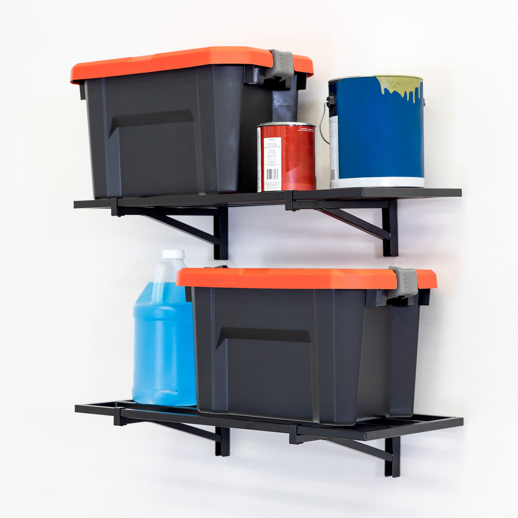 Two black storage bins with orange lids and various cleaning supplies are neatly arranged on 1' x 2' Bristol Garage Wall Mount Shelves (2 Pack, Black) installed against a white wall.