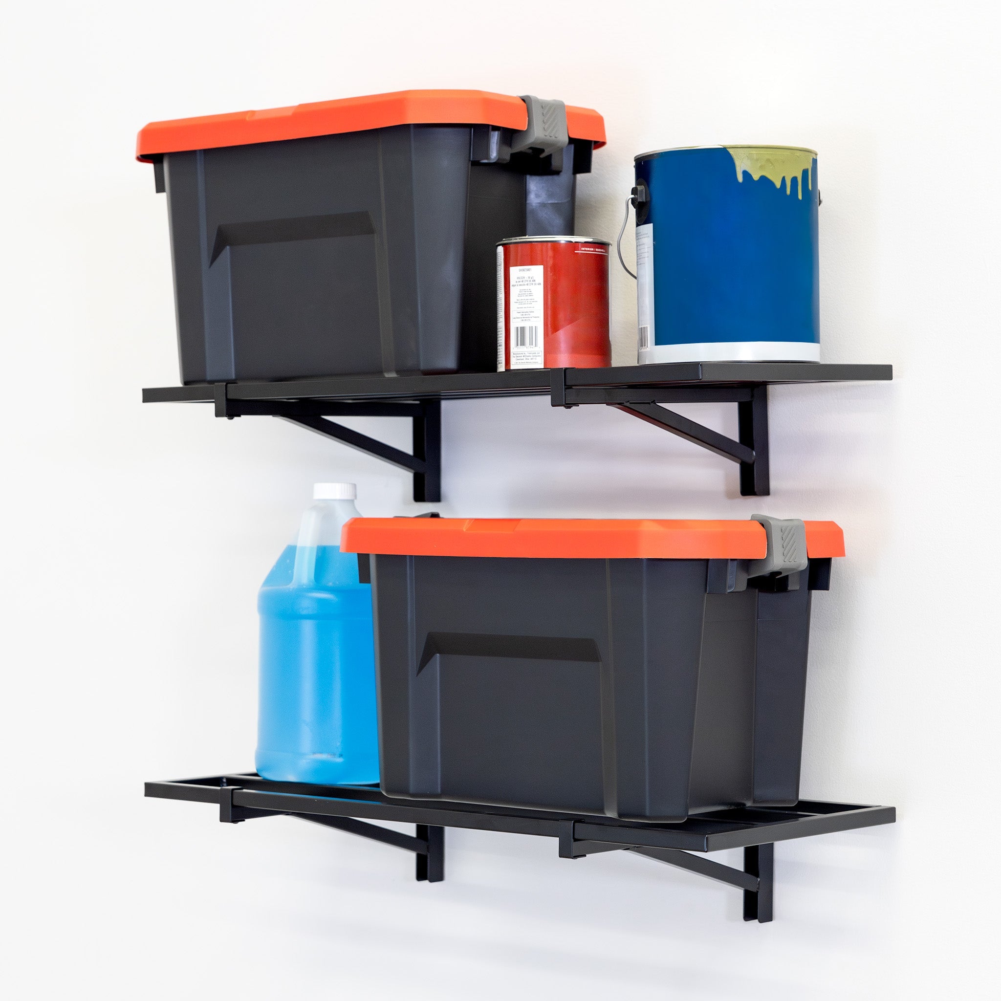 Two black storage bins with orange lids and various cleaning supplies are neatly arranged on 1' x 2' Bristol Garage Wall Mount Shelves (2 Pack, Black) installed against a white wall.