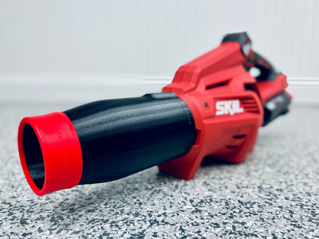Close-up of the STUBBY® Car Drying Nozzle for SKIL PWR Core 40V Leaf Blowers (BL4713C-11 & BL4713-10) attached to a red and black SKIL blower, shown on a speckled gray floor with the nozzle in focus.