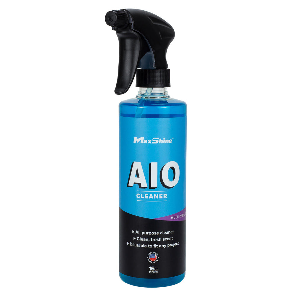 A blue spray bottle labeled MaxShine Interior Car Cleaner | AIO Cleaner (16oz, 1gal) with a black trigger nozzle offers a clean, fresh scent and is ideal for car detailing or interior cleaning projects.