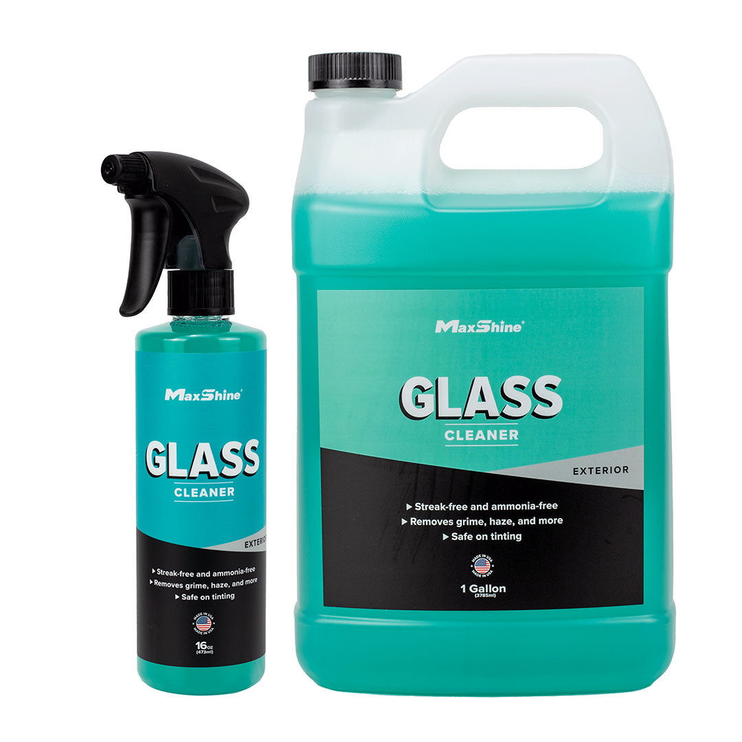 Two bottles of Car Glass Cleaner (16oz spray & 1gal jug) with teal labels and white/black text. This ammonia-free formula is safe for tinting and ideal for cleaning car glass.