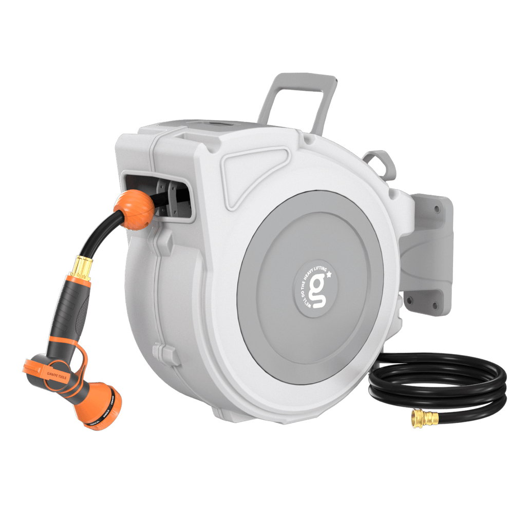 The Retractable Garden Hose Reel-1/2 in-65ft, with a gray wall-mounted case, includes an orange and black multi-function nozzle and a separate coiled black hose with brass fitting, all displayed against a white background.