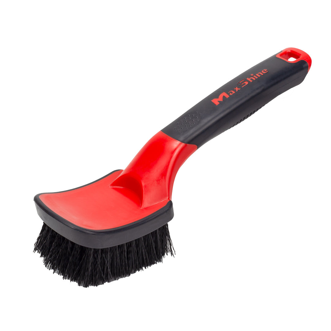 The Soft Grip Heavy Duty Tire Brush with Short Handle features stiff red and black bristles, a curved design, comfortable soft grip, and the MaxShine logo. Ideal for cleaning tough dirt from tires.
