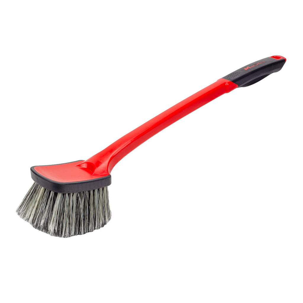 The Soft Grip Medium Duty Wheel Cleaning Brush with Long Handle features black and white bristles, a red handle, and an angled design for effective wheel or engine bay cleaning.
