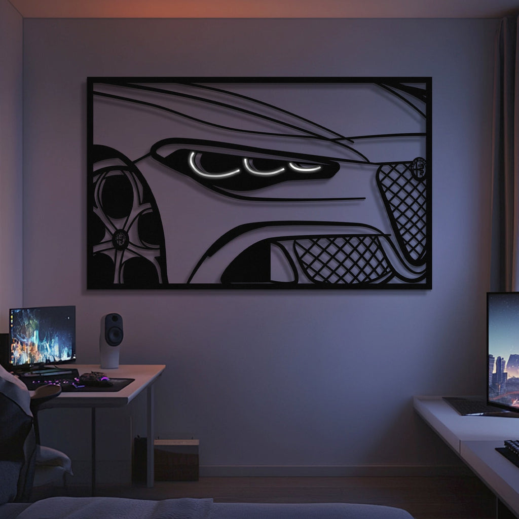 A modern bedroom showcases the 2025 Quadrifoglio Apex Front View Metal Neon Frame Wall Art (MT1474), dual computer desks with monitors, soft lighting, and minimal decor—an ideal gift for any car enthusiast.