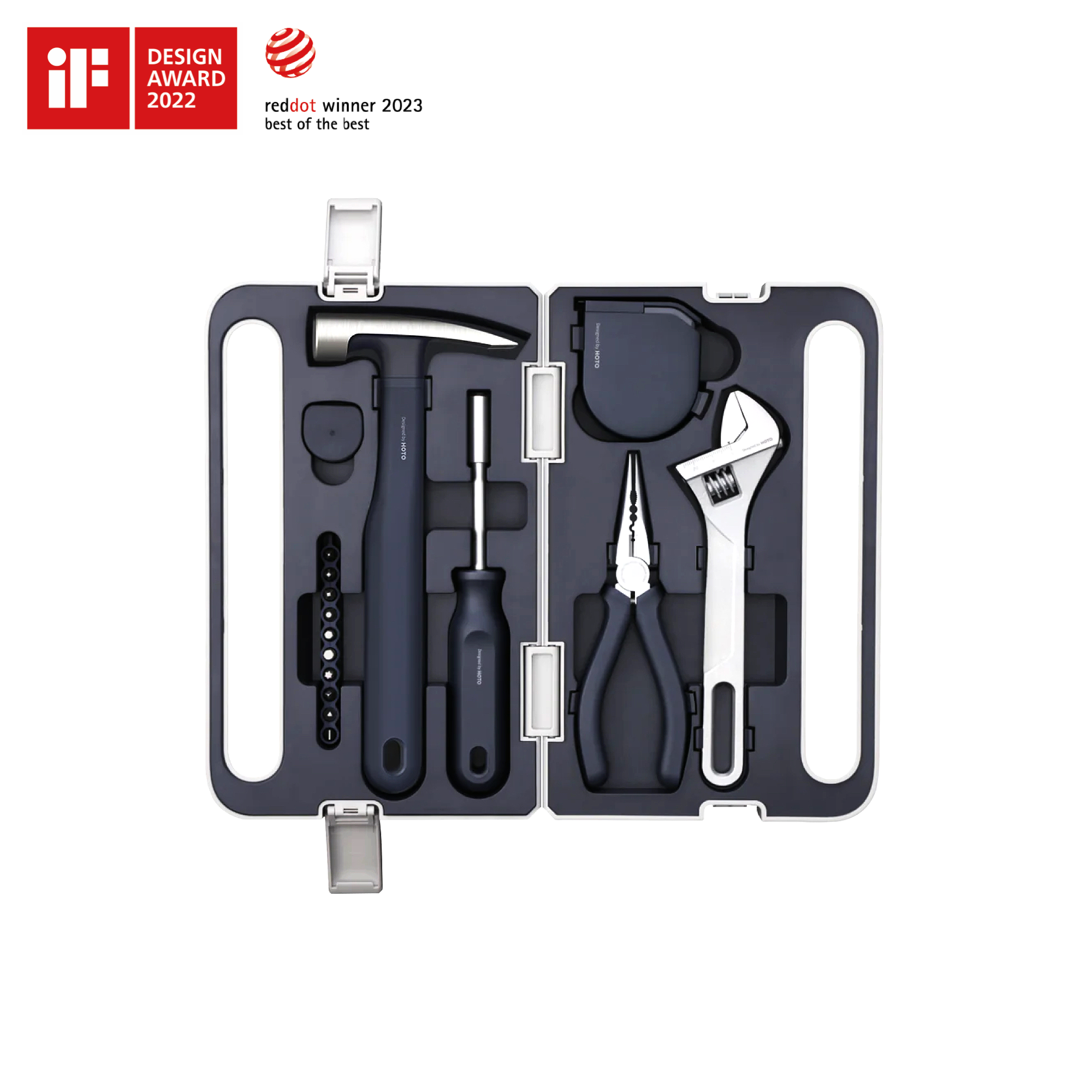 The Hand Tool Set is a compact black kit with a hammer, screwdriver, pliers, wrench, tape measure, and hex keys organized in a hard case. It features minimalist design and two design award logos displayed in the top left corner.