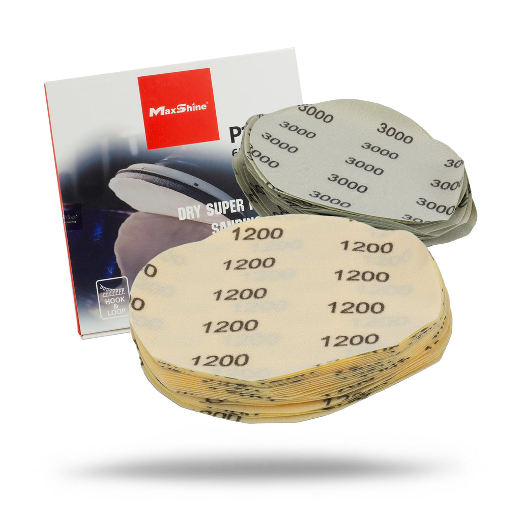 A stack of 6-inch Sanding Paper Discs - 25 Pack (1200 and 3000 grit) is displayed in front of a MaxShine Dry Super Sanding Disc box with red and white packaging.