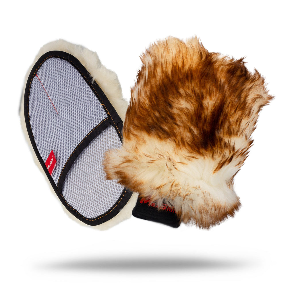 The Super Sheepskin Wash Mitts feature brown and white fluffy wool on one side and a mesh back with two black hand straps, ideal for car cleaning. Shown floating against a white background.