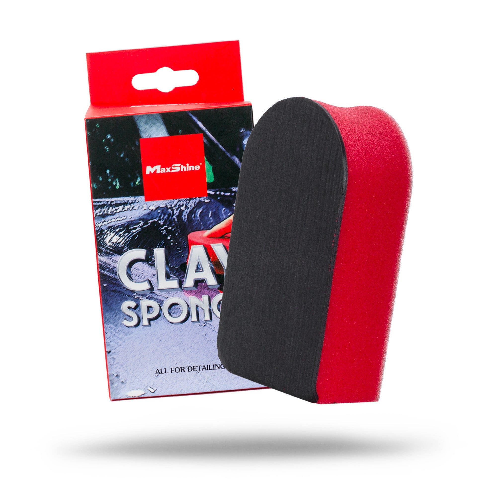 A red and black Clay Sponges & Wash Pads product is shown vertically before its packaging, which displays the product name and a car being detailed. This clay sponge helps remove paint contaminants for a smooth finish.