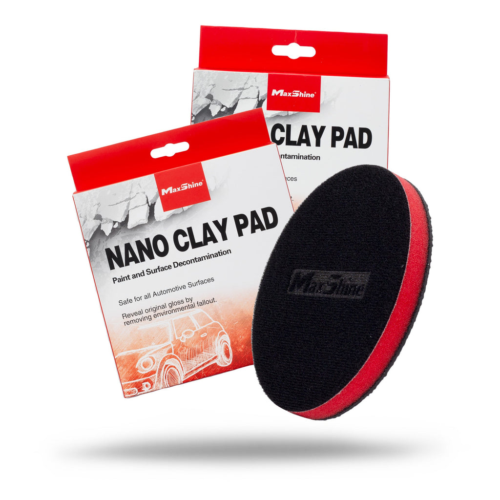 A black and red Clay Bar Car | Clay Pad is shown in front of two red and white NANO CLAY PAD packages, designed for paint and surface decontamination—an ideal alternative to traditional clay bar methods.