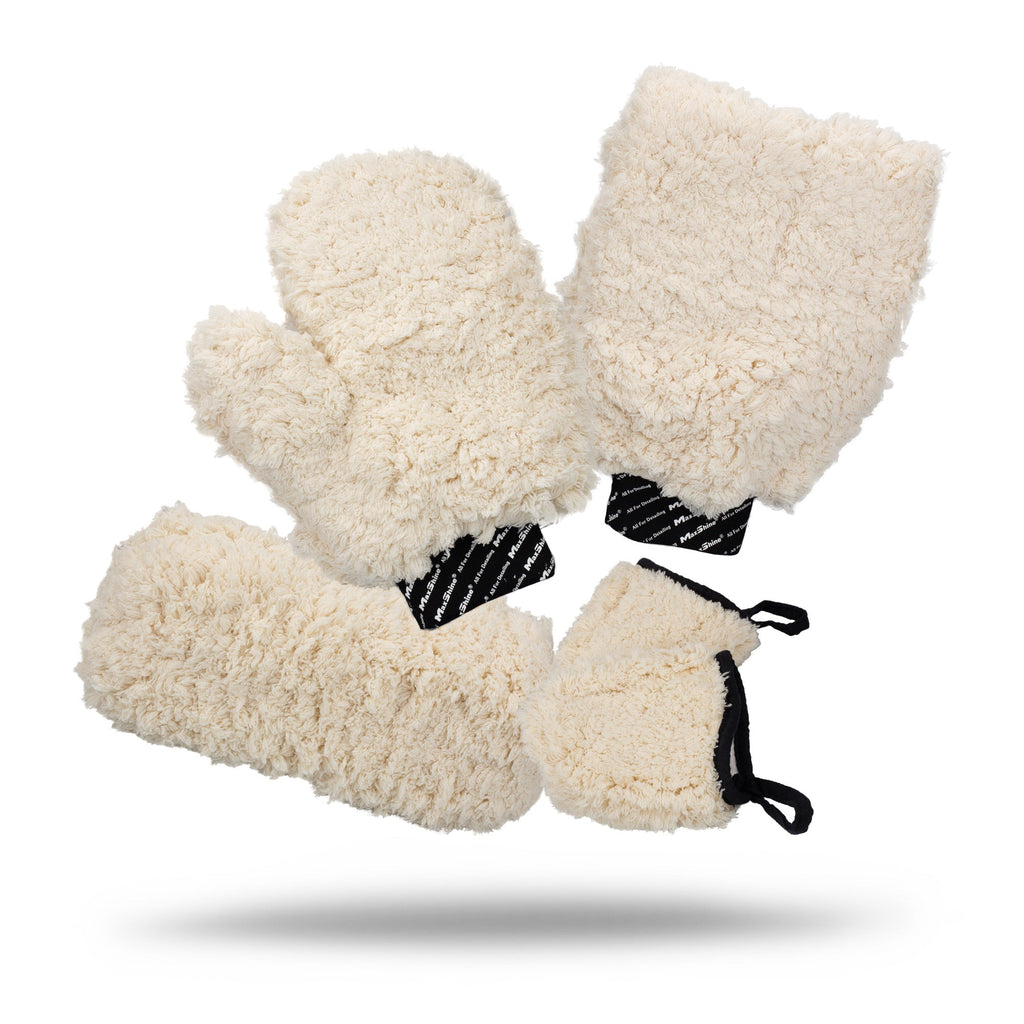 Four cream-colored Microfiber Wash Mitts with black and white or black elastic cuffs are displayed on a white background, each casting a faint shadow underneath.