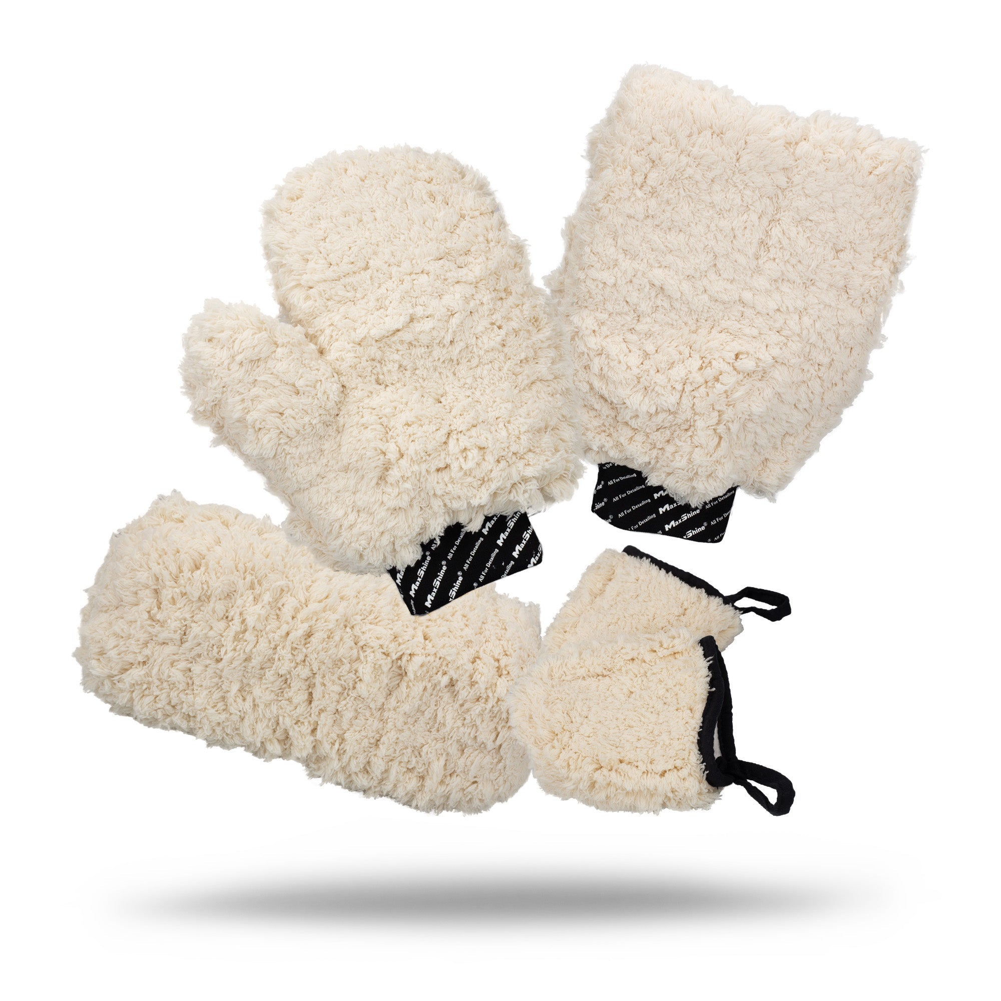 Four cream-colored Microfiber Wash Mitts with black and white or black elastic cuffs are displayed on a white background, each casting a faint shadow underneath.